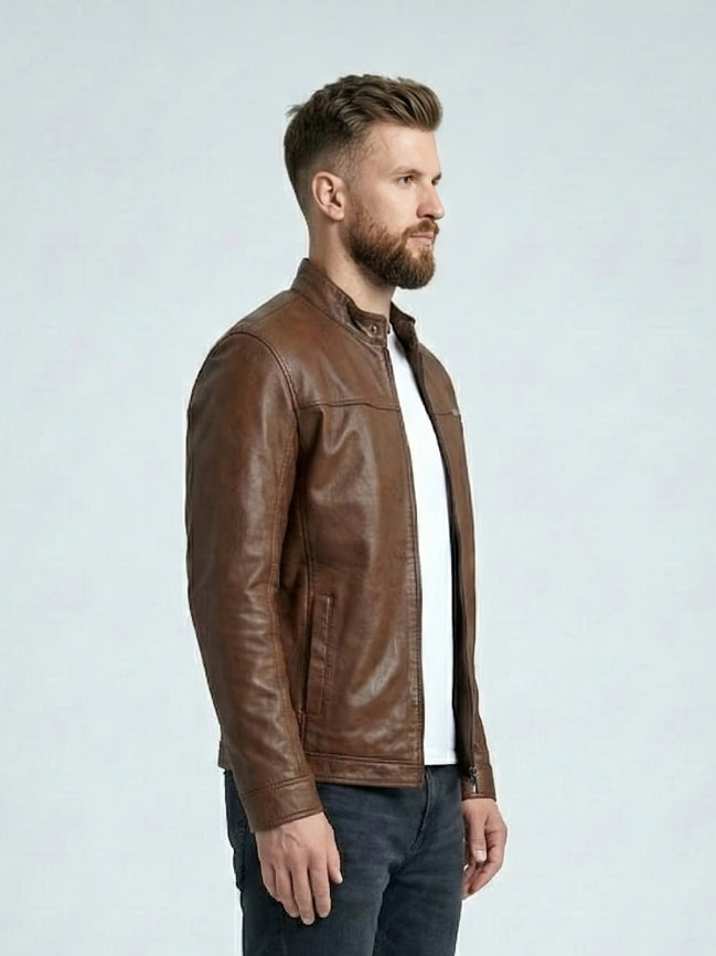 Man wearing a brown leather jacket on a light gray background