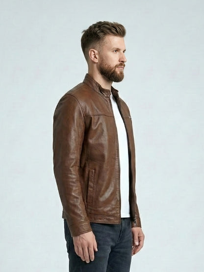Man wearing a brown leather jacket on a light gray background
