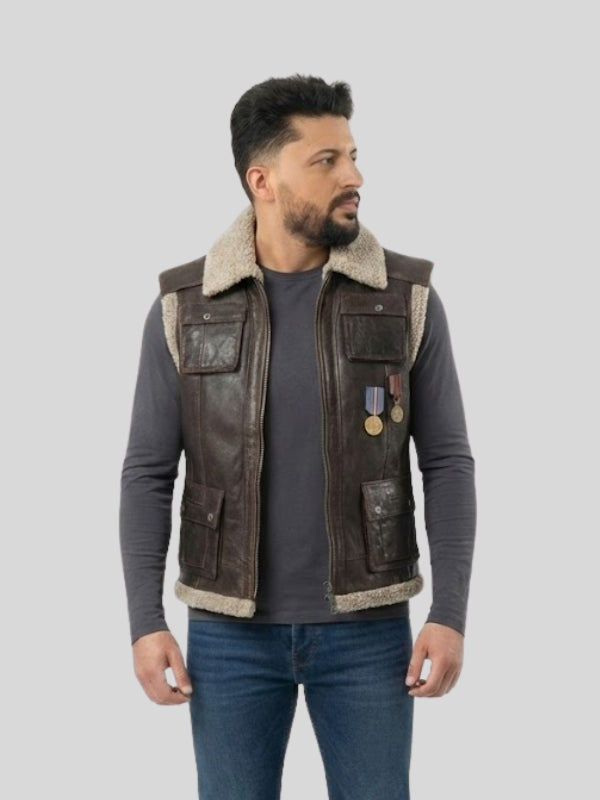 Man wearing a brown leather vest with fur lining on a gray background