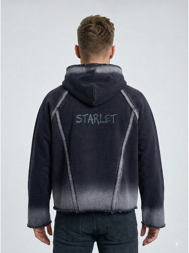 Person wearing a black and gray gradient jacket with 'STARLET' branding on the back against a light gray background.