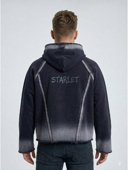 Person wearing a black and gray gradient jacket with 'STARLET' branding on the back against a light gray background.