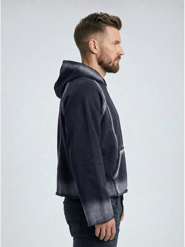Man wearing a gray hoodie with gradient design on a white background